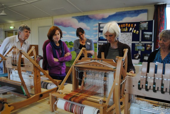 people learning weaving skills
