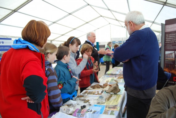 children examining archaeological remains