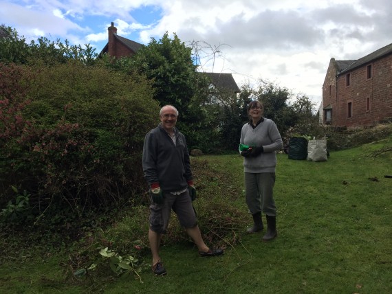 two volunteers at work