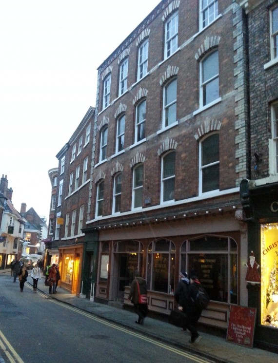street view, York busy shop with empty flats above