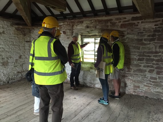 SPAB members at Warwick Bridge Visitors looking at window detail inside Warwick Bridge Mill