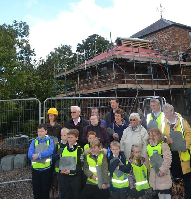 children with slates for mill roof