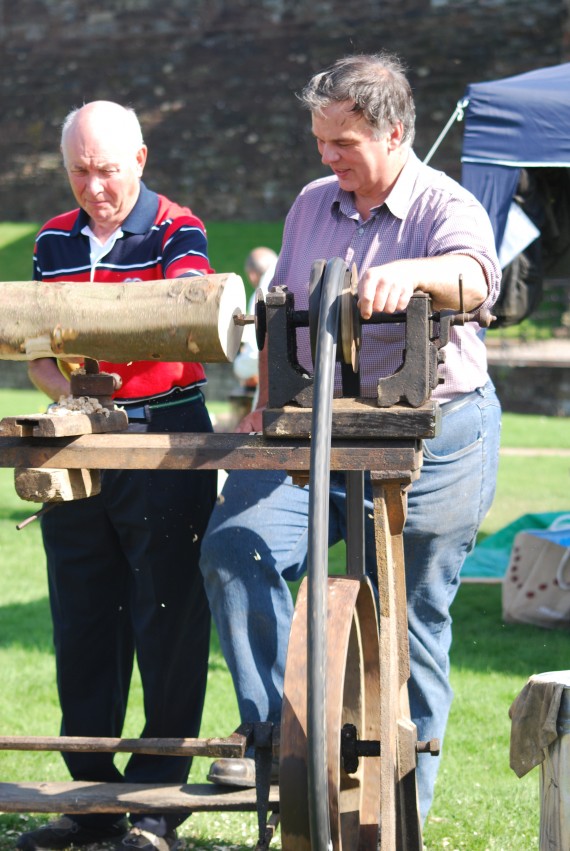 man working hand lathe