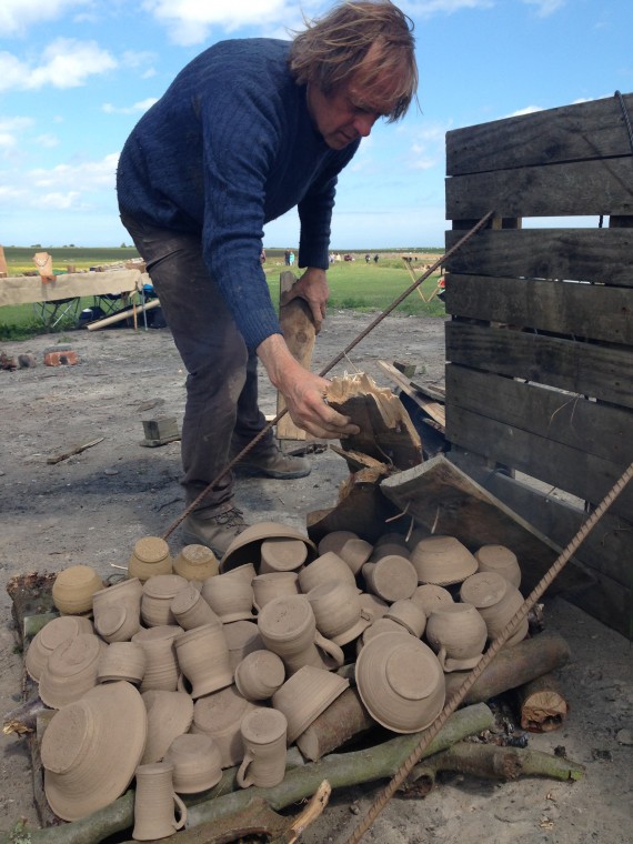 unfired clay pots ready to burn