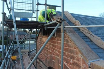 man working on building